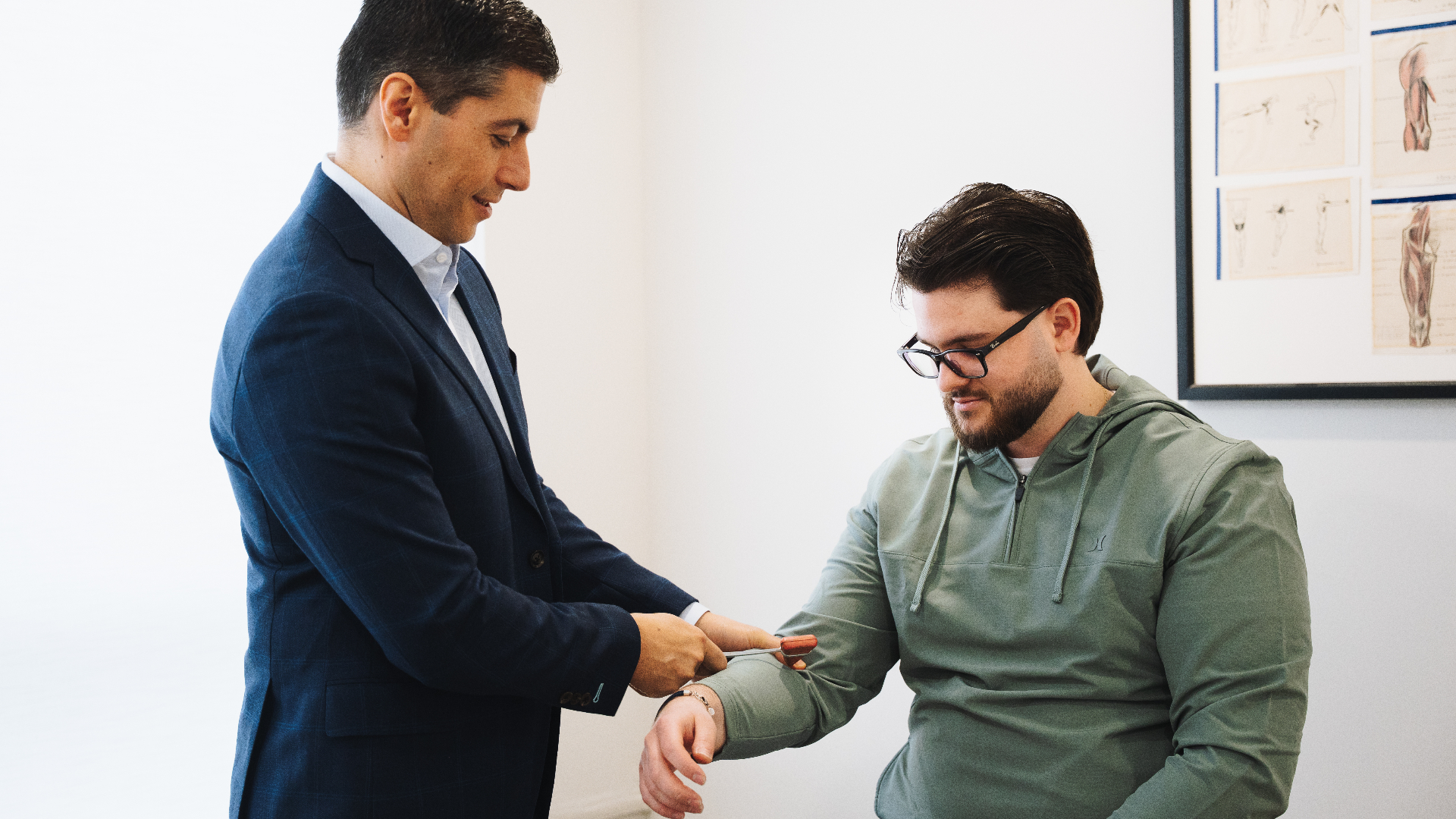 Dr. Golan performing a clinical neurological examination on a patient